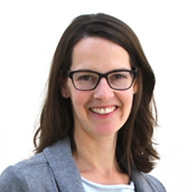 Headshot of Professor Read. A woman with long light brown hair and hazel eyes